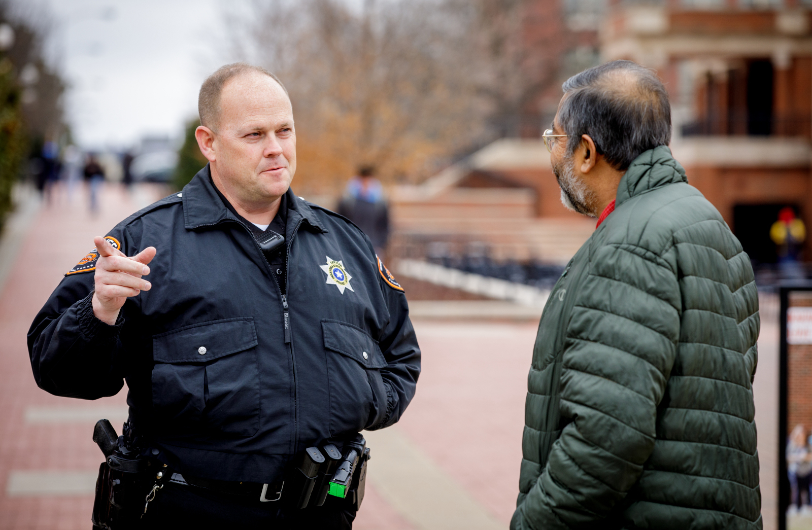 sergeant queen talking with man on campus