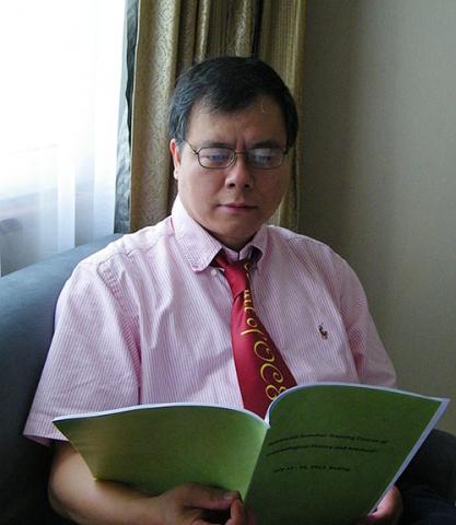 Haobo Jiang Reading a Booklet
