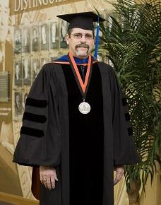 Ronald Van Den Bussche in Commencement Regalia